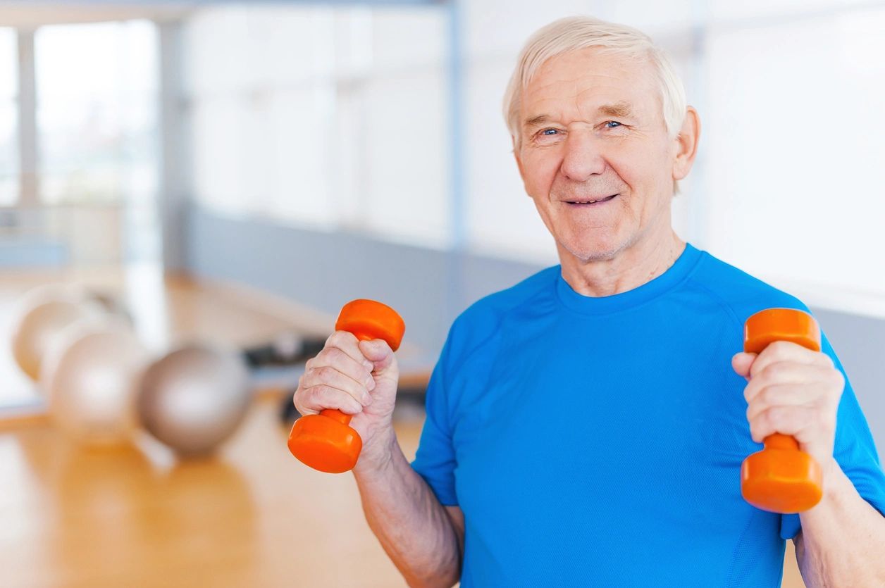 Physiotherapist holding patient hands with care